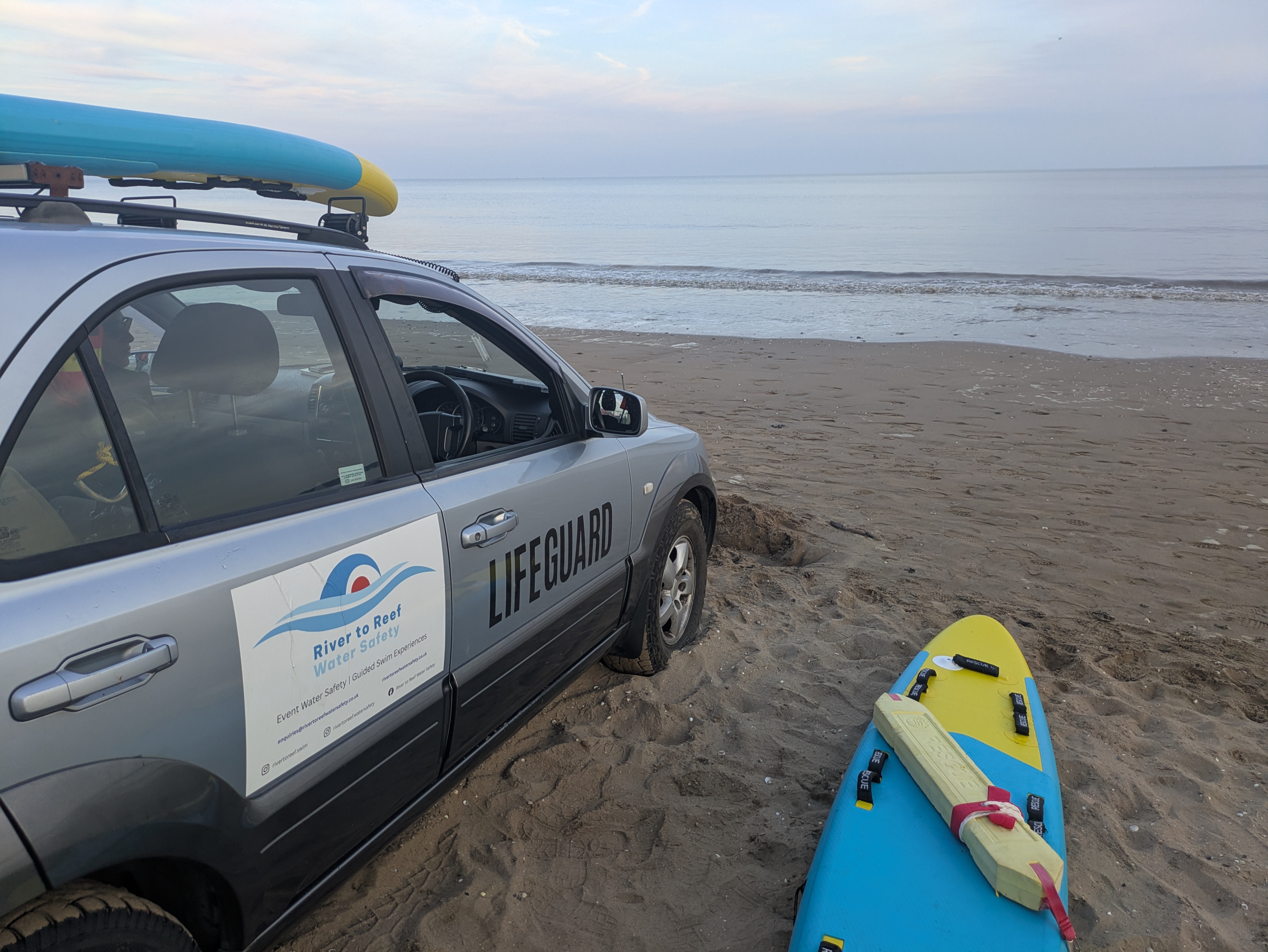 Safety crew monitoring swimmers from the water